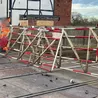 Car crashes into barriers at level crossing in Hilton