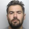 Self-confessed junkie strangled housemate to death with headphone cable