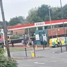 Fire service and police close road near petrol station in Derby