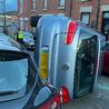Car flips onto its side in crash in residential Derby street