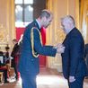 Overwhelming day of pride for Derby businessman as he collects MBE award from Prince William